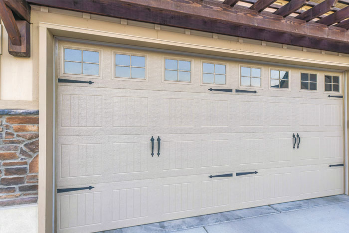 Modern garage door installation in Toronto – beige sectional garage door