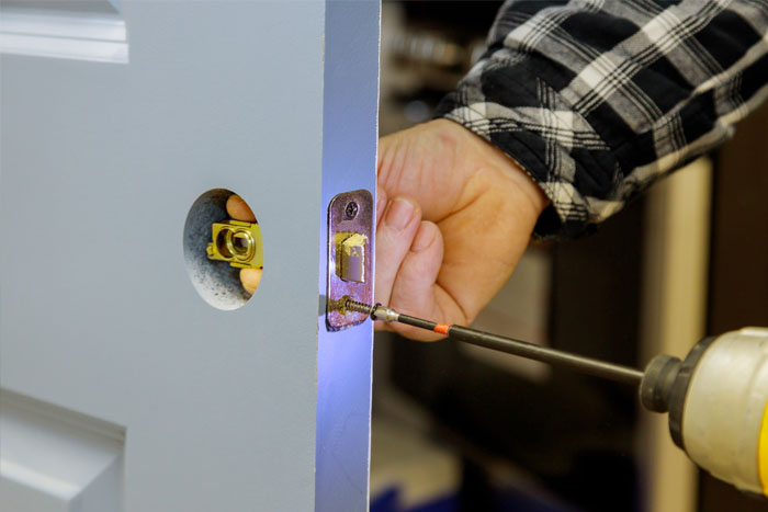 Professional door installation in Toronto – technician fitting new door