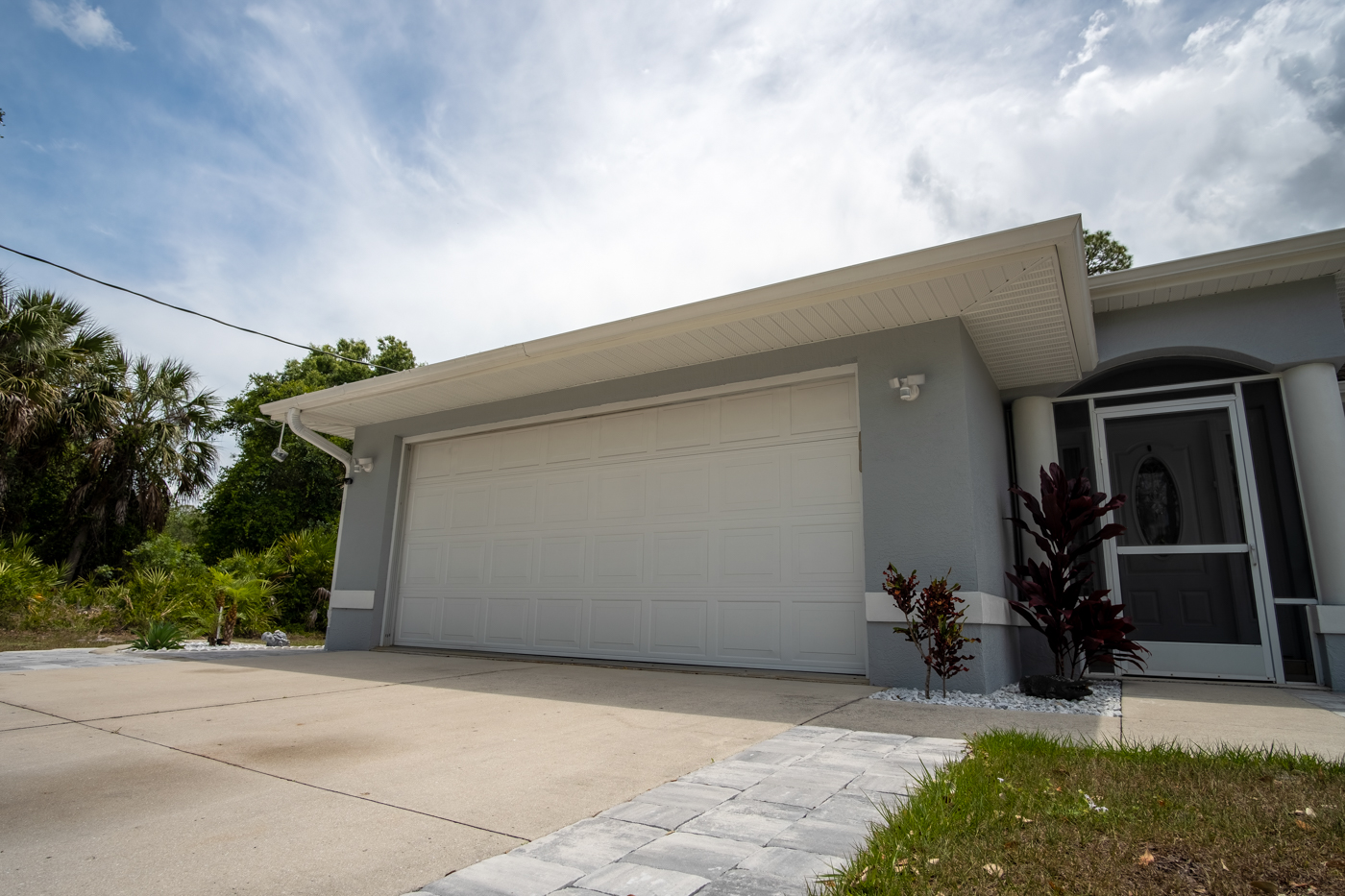 Modern residential garage door on Canadian home lawn
