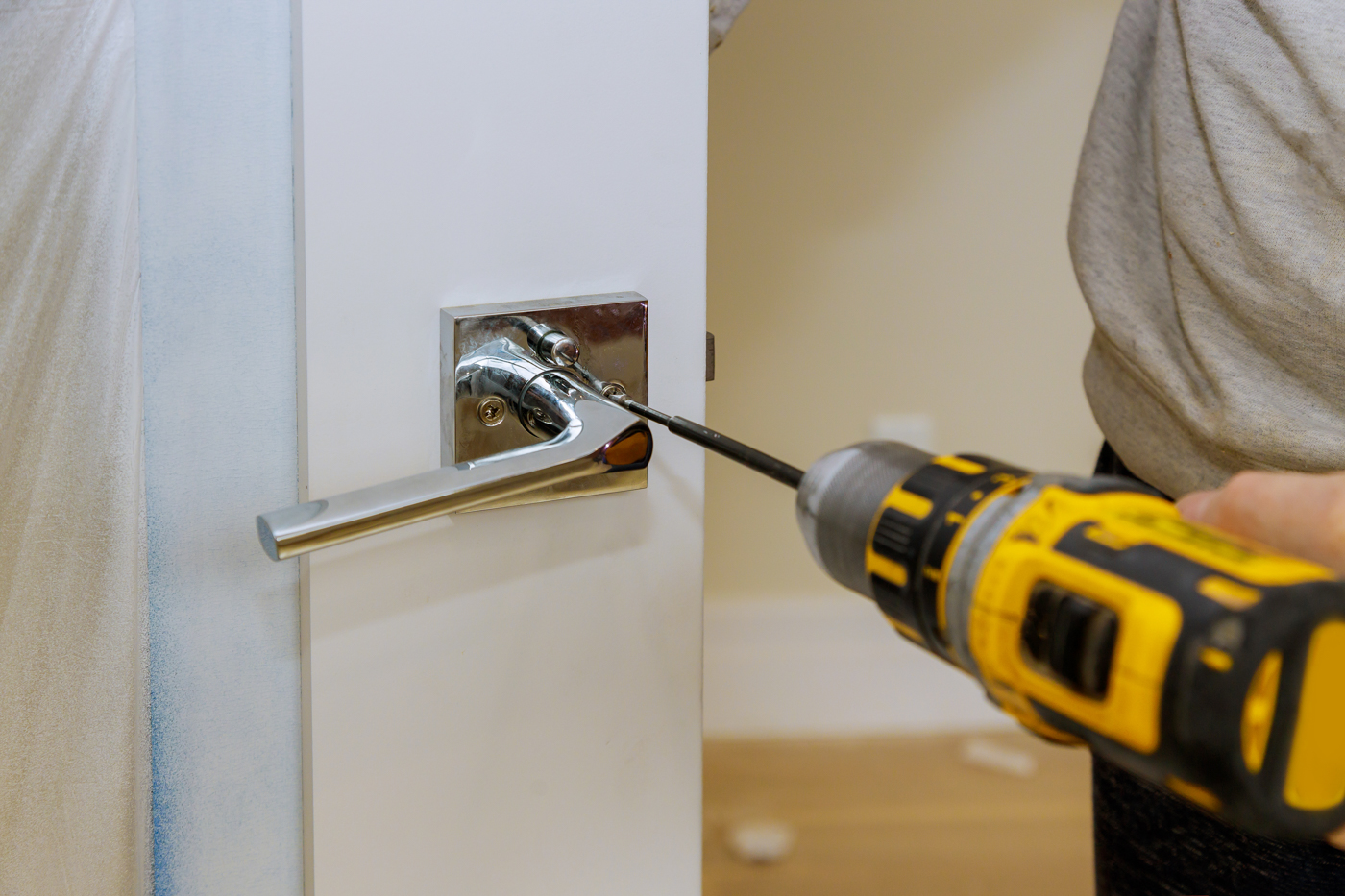 Locksmith installing secure mailbox door lock