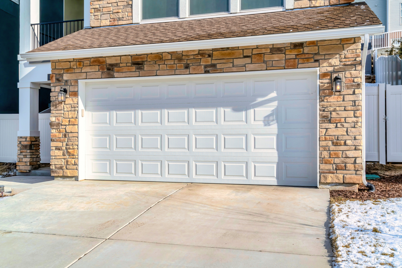 Modern steel garage door on Canadian home driveway