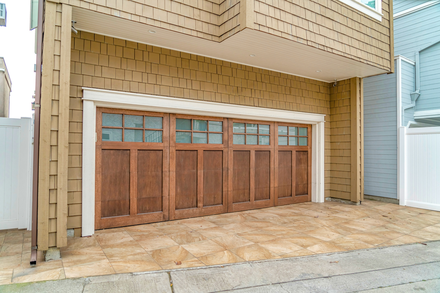 Modern wood roller garage door on Canadian home exterior