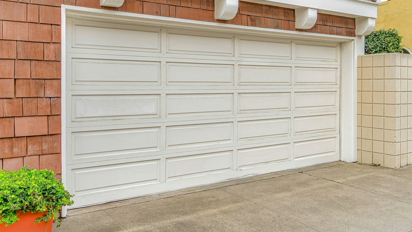 Modern residential garage doors on Canadian home driveway