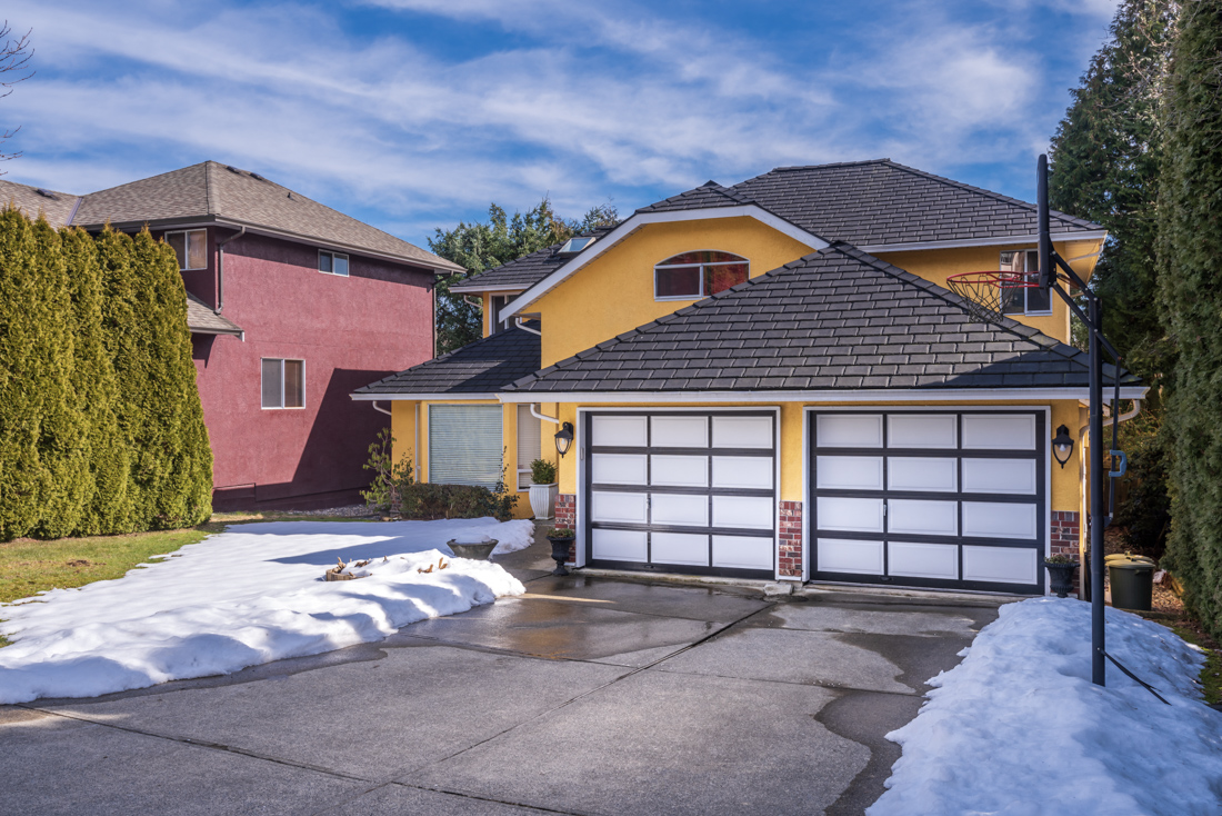 Traditional wood garage doors at Canadian home