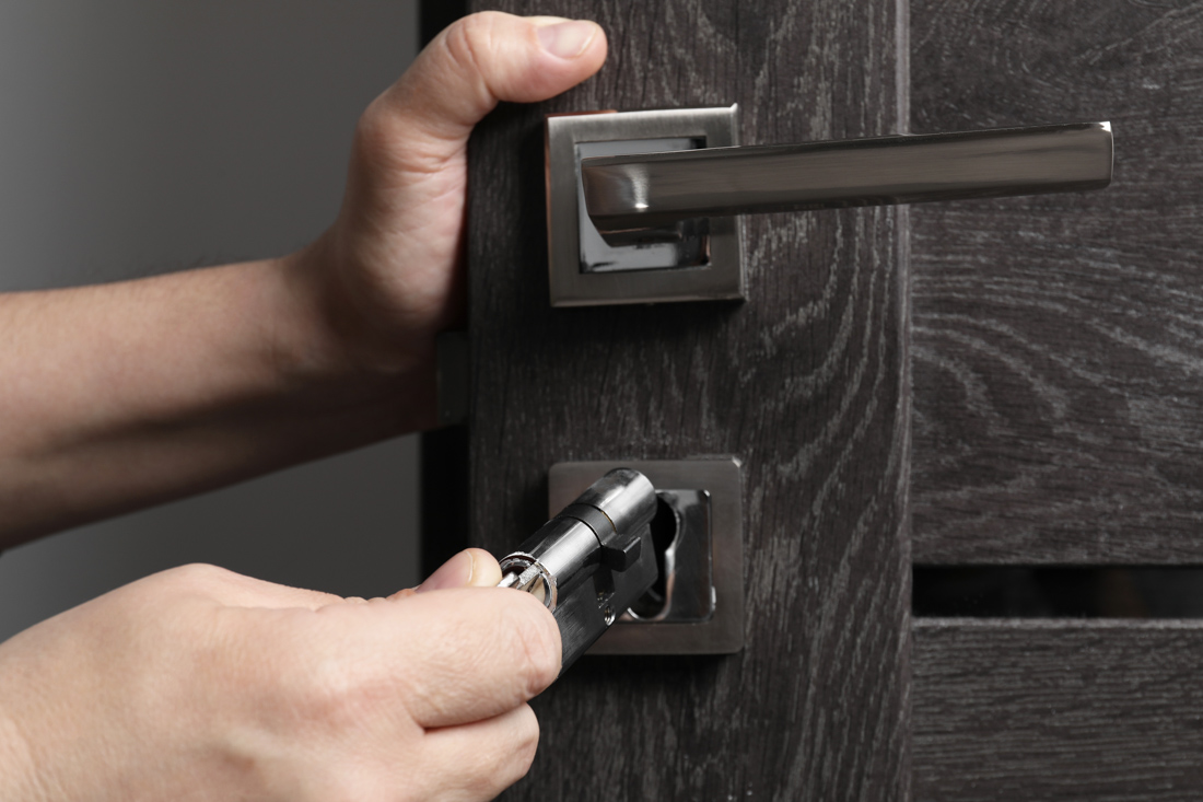 Locksmith repairing townhome lock
