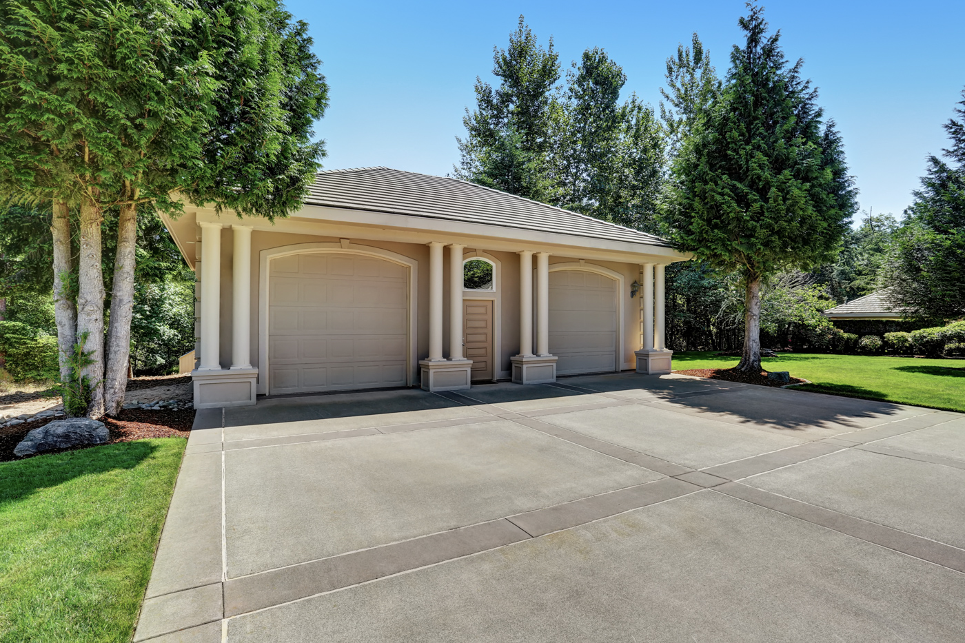 Residential garage doors on Canadian driveway