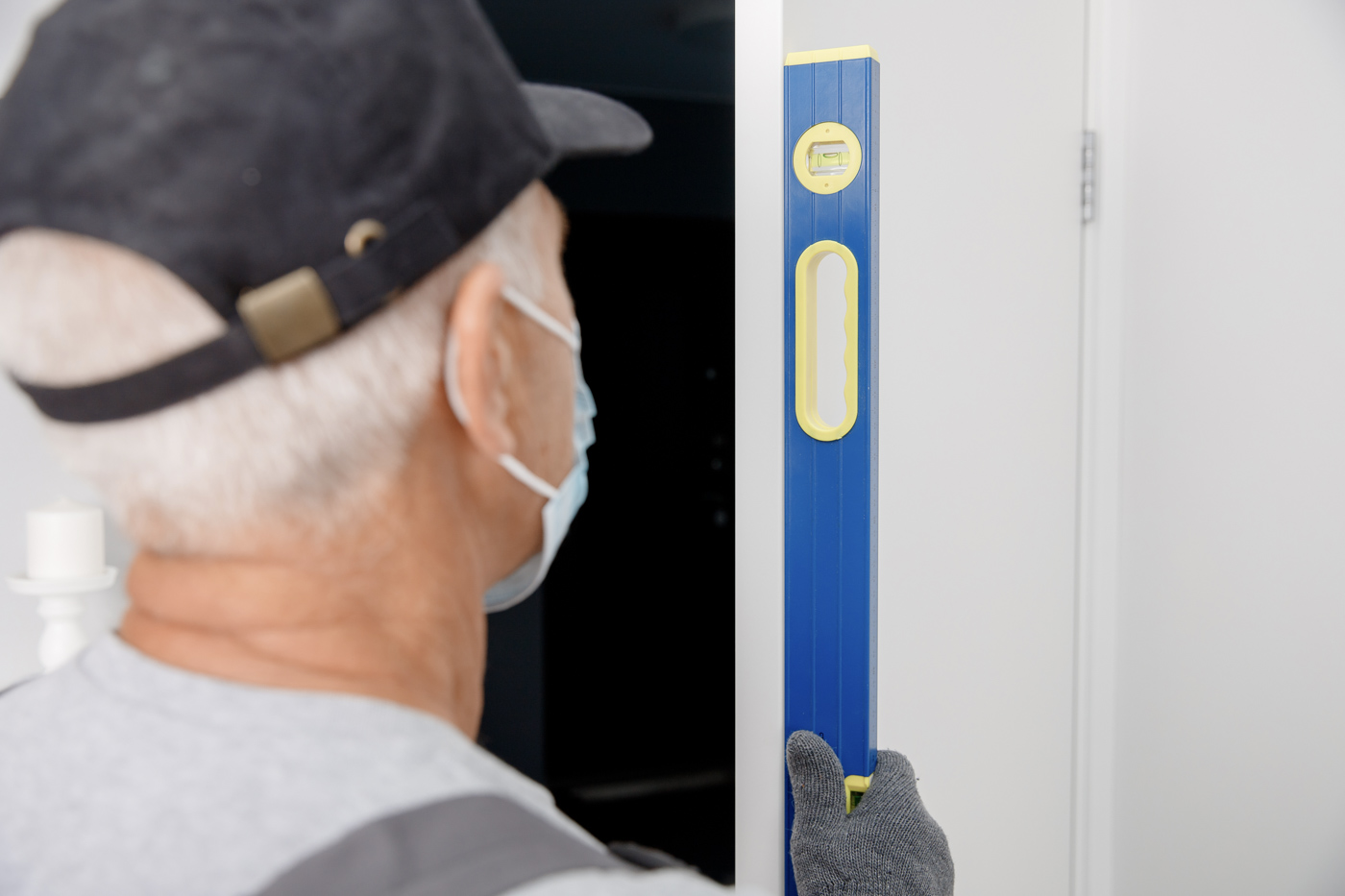 Locksmith checking door lock standards