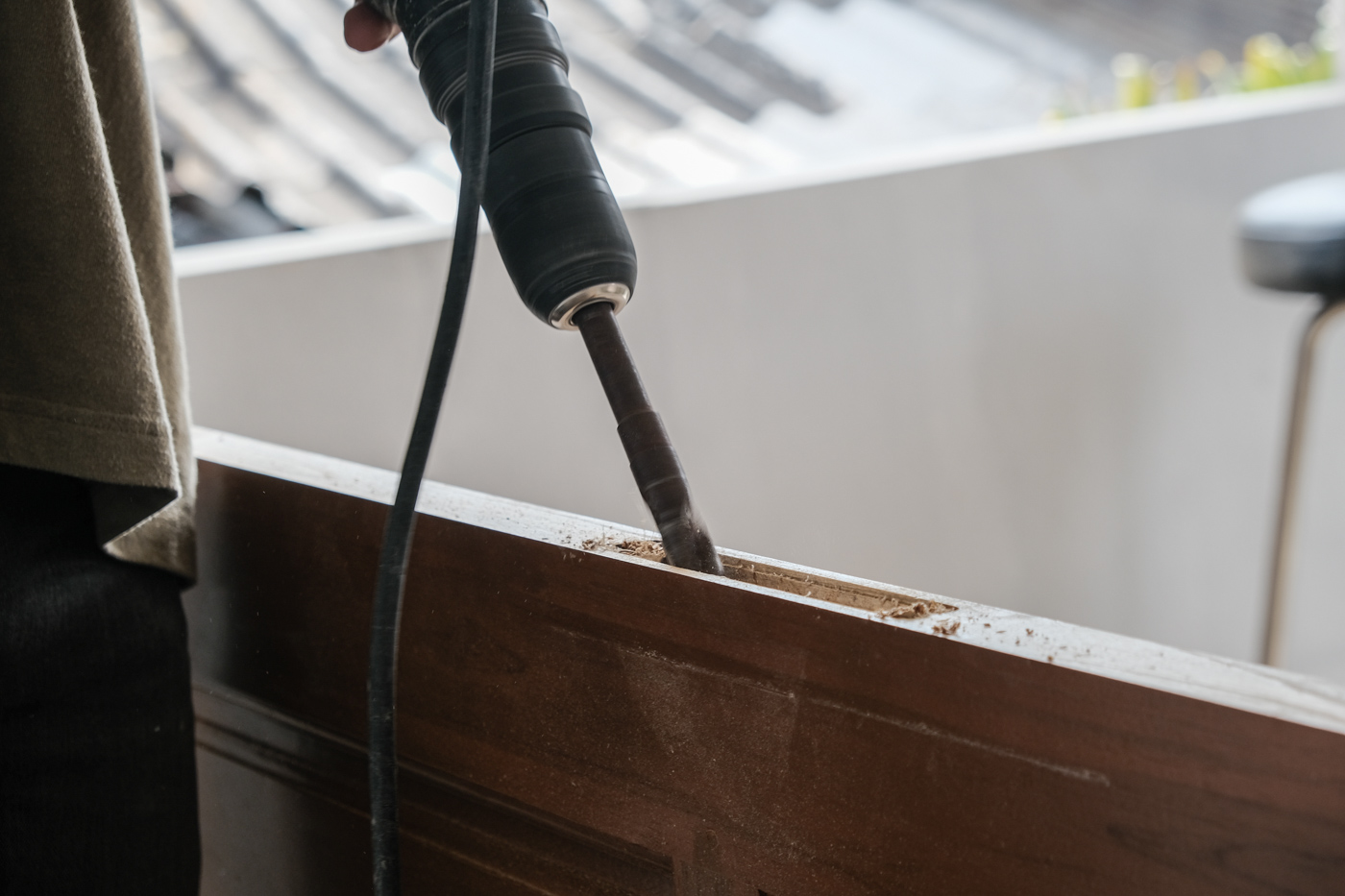 Door repair drilling wood panel